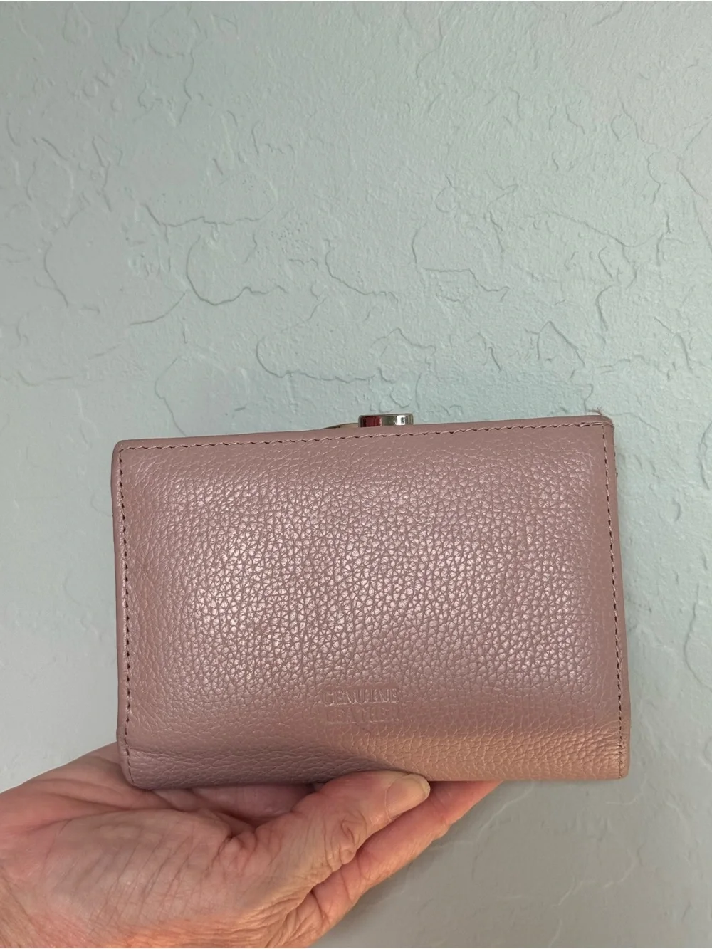 Pink pebbled leather Giani Bernini wallet featuring a snap-tab closure